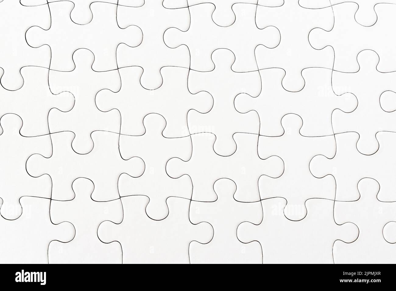 close-up view of plain white jigsaw puzzle background Stock Photo