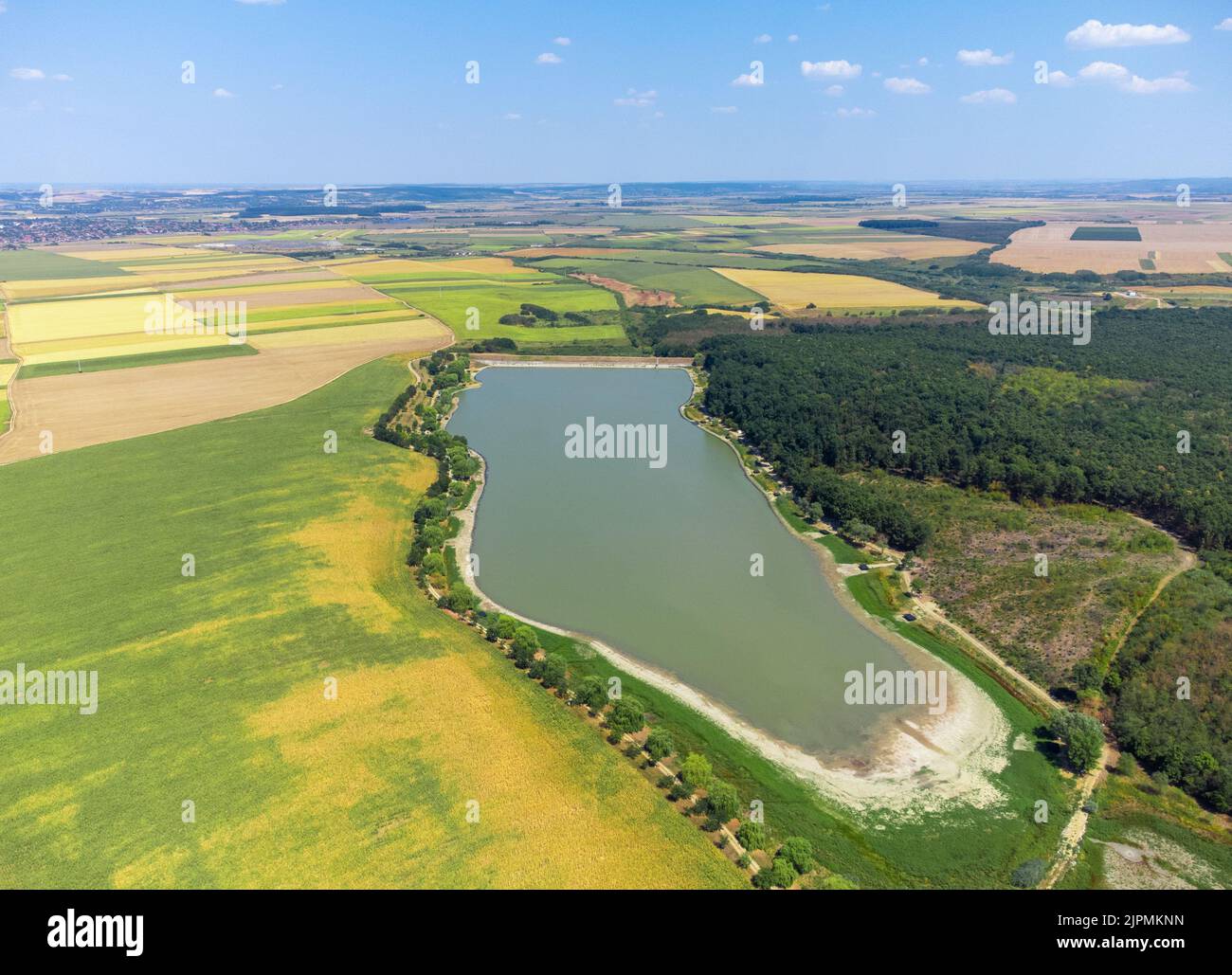 a small artificial lake built against floods in the downstream towns