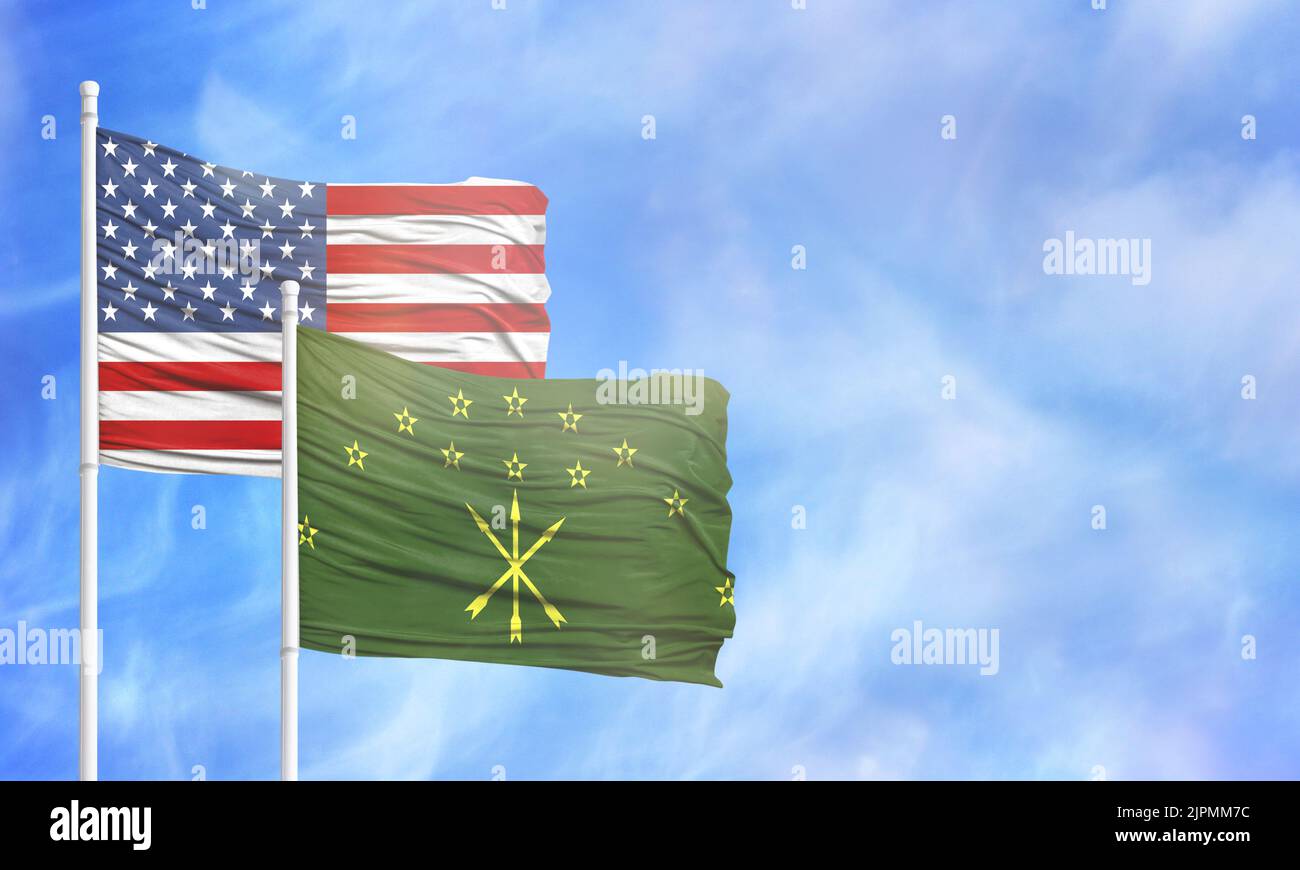 Waving American flag and flag of Adygea. Stock Photo