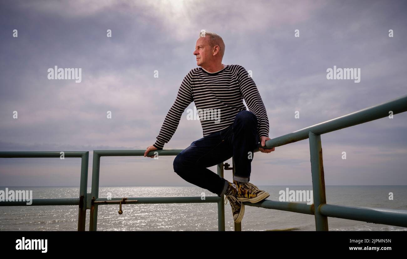Editorial Use Only - Norman Cook photographed at his seafront home in Hove, East Sussex, UK. March 2022. Picture by Jim Holden Stock Photo