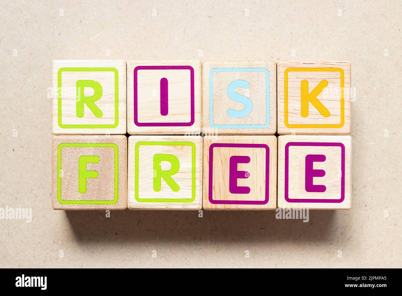 Color letter block in word risk free on wood background Stock Photo - Alamy