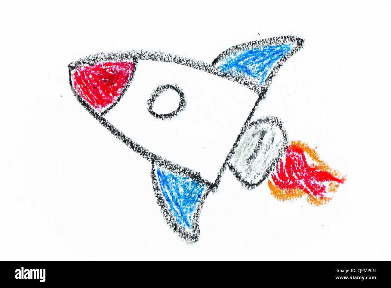 Colorful oil pastel hand drawing in spaceship or rocket shape on white paper background Stock