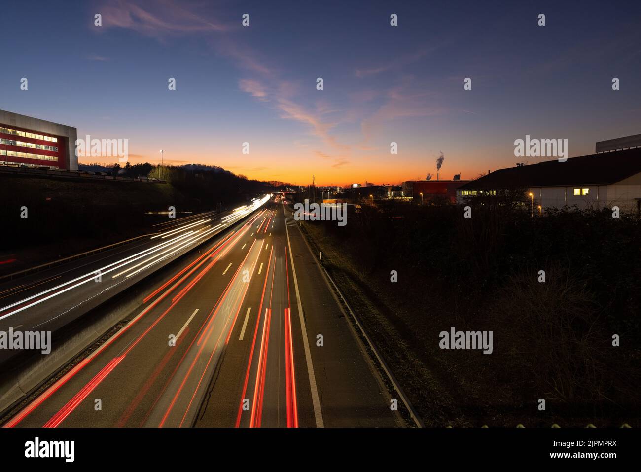 A long exposure of cars light on the road during the sunset Stock Photo ...
