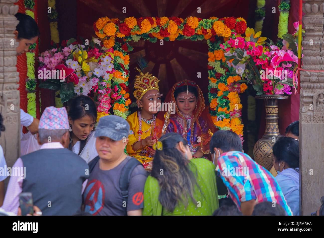 Devotees worship the children dressed as Lord Radha and Krishna in ...