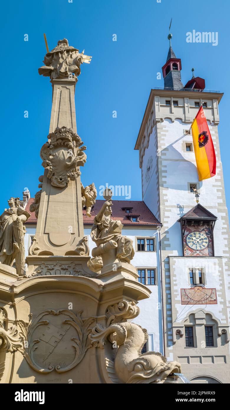 Germany, Wurzburg, upward view of the Town Hall with the Four-Pipe fountain in the foreground Stock Photo