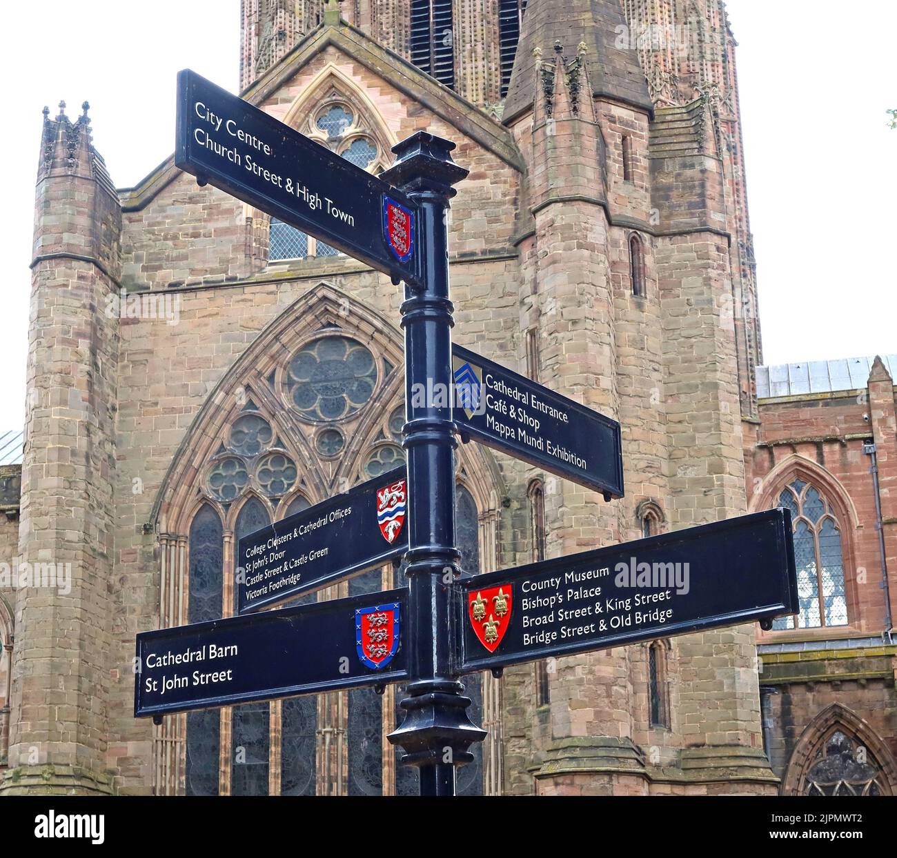 Hereford signposts to city attractions, Cathedral barn, county museum,  bishops palace, Bridge St and old bridge, outside the cathedral Stock Photo