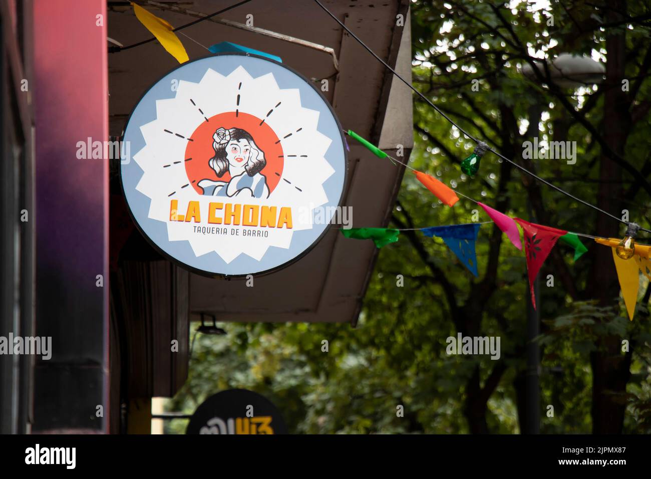 Belgrade-Serbia - May 28, 2022: Entrance outdoor restaurant round sign board in Dorcol - area full of bars and restaurants to go out for food and drin Stock Photo