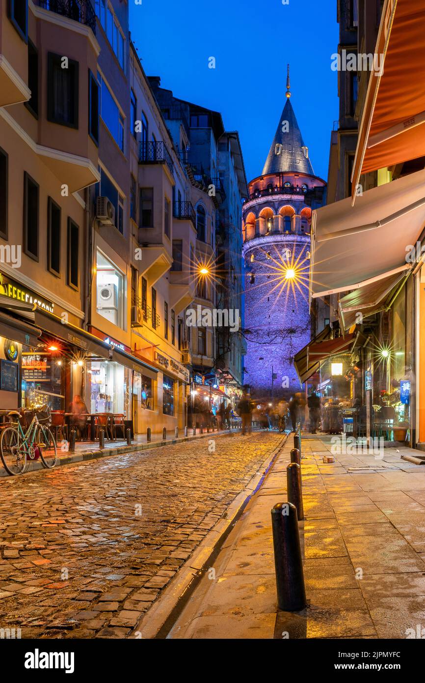 A vertical shot of Galata Tower at night in Istanbul Stock Photo - Alamy