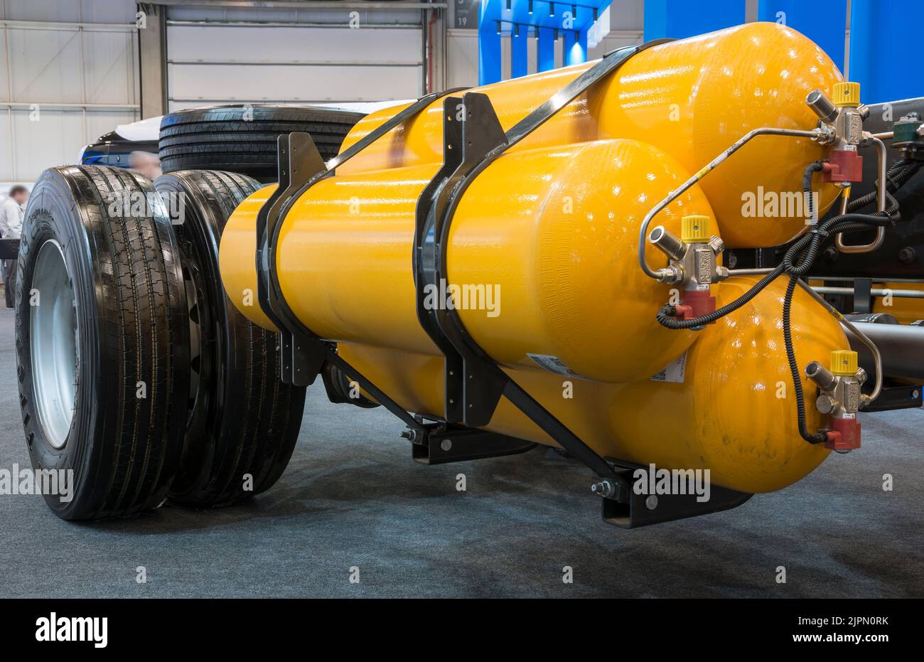 Exposed chassis, engine and gears of a natural gas powered bus on display at the LAT.BUS 2022