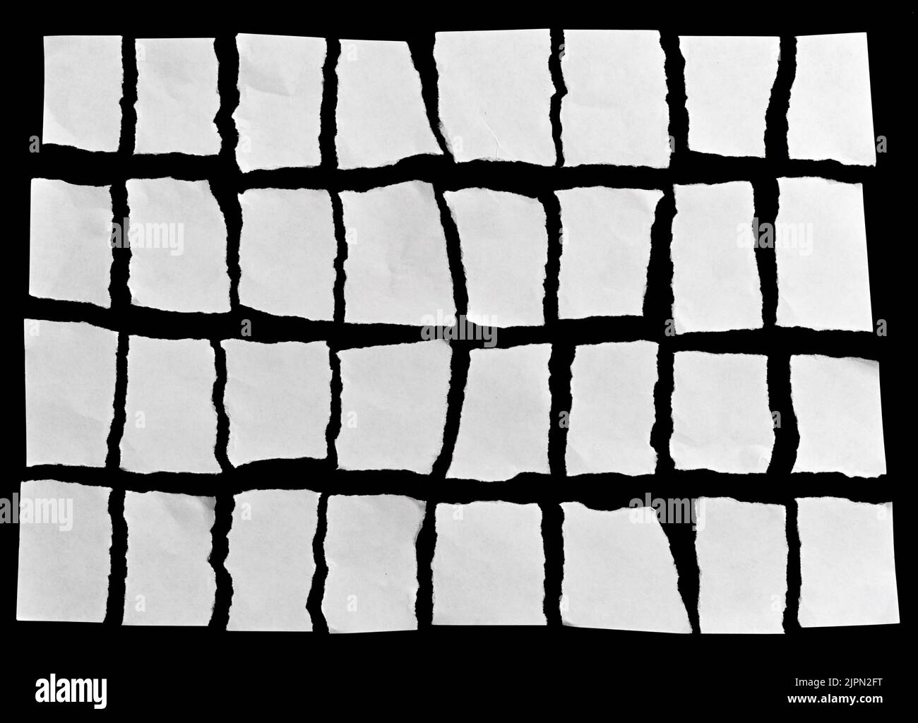 White torn paper on black background Stock Photo