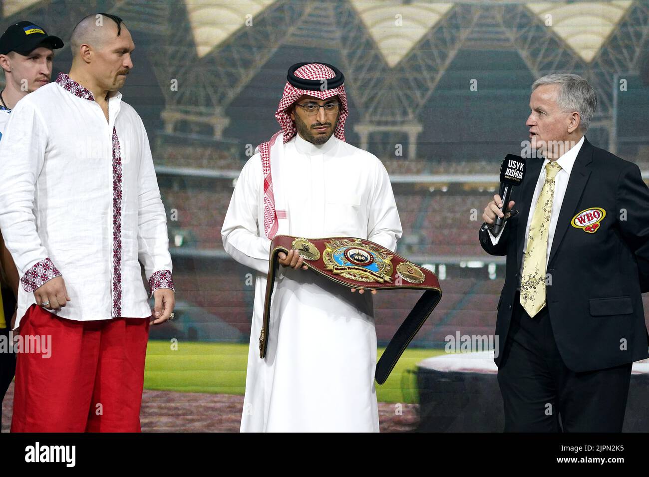 Prince Fahad Bin Abdulaziz Al Saud (centre) presents Oleksandr Usyk (left) with the new WBO Heavyweight Super World Title belt during the weigh in at the King Abdullah Sport City Stadium in Jeddah, Saudi Arabia. Picture date: Friday August 19, 2022. Stock Photo