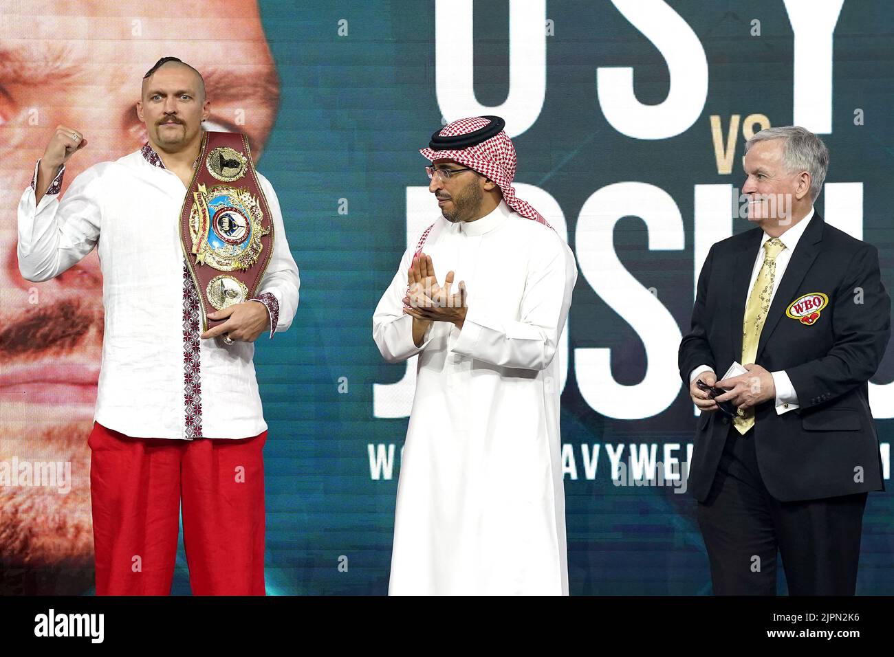 Prince Fahad Bin Abdulaziz Al Saud (centre) presents Oleksandr Usyk (left) with the new WBO Heavyweight Super World Title belt during the weigh in at the King Abdullah Sport City Stadium in Jeddah, Saudi Arabia. Picture date: Friday August 19, 2022. Stock Photo
