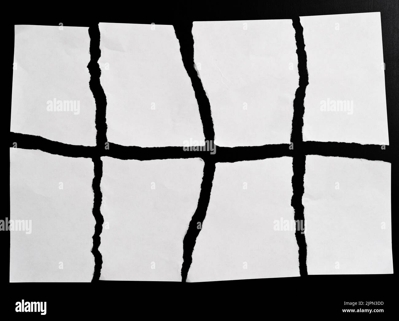 White torn paper on black background Stock Photo