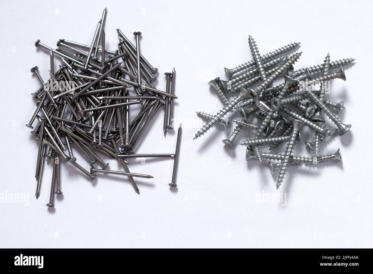 Nails and screws, isolated on white background. Stock Photo