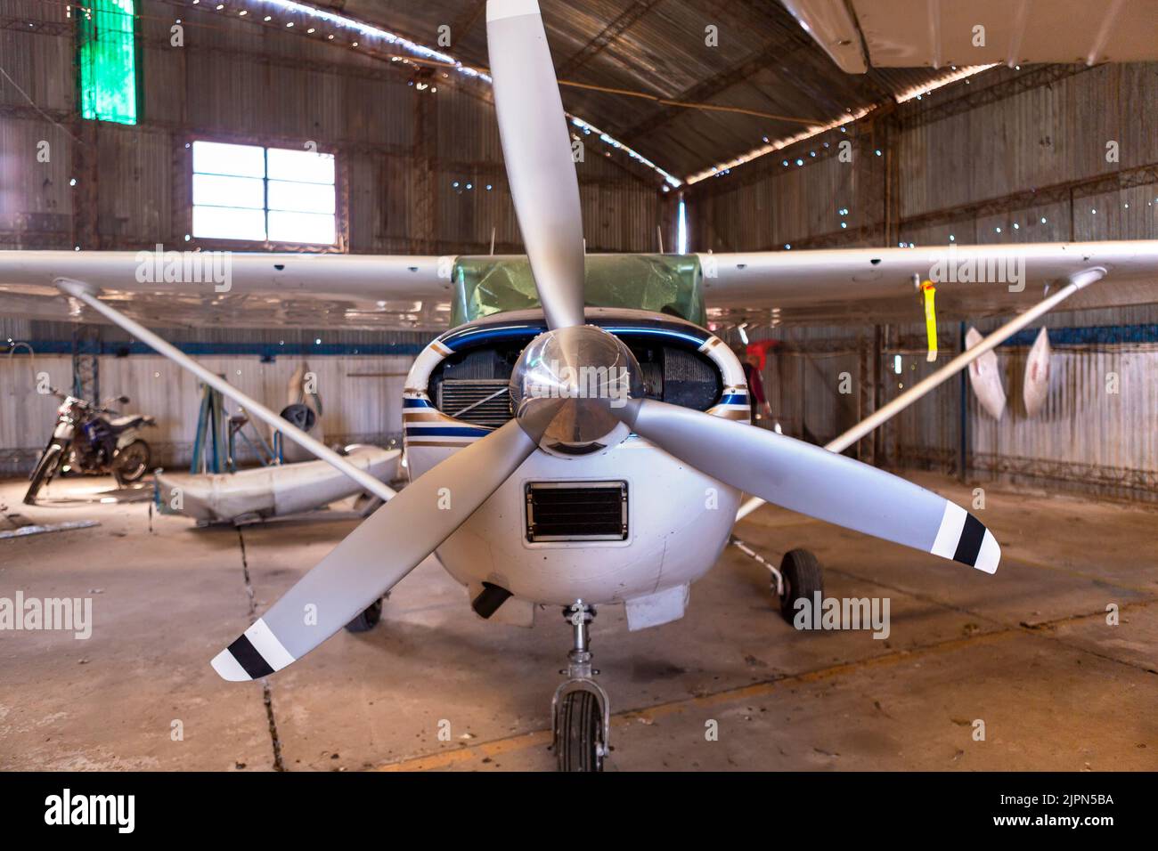 plane frontal inside the hangar Stock Photo
