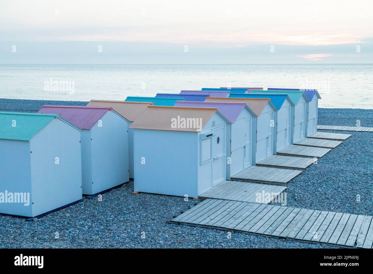 France, Seine Maritime, Cote d'Albatre, Le Treport, pebble beach and beach cabins in the evening // France, Seine Maritime (76), Côte d'Albatre, Le Tr Stock Photo