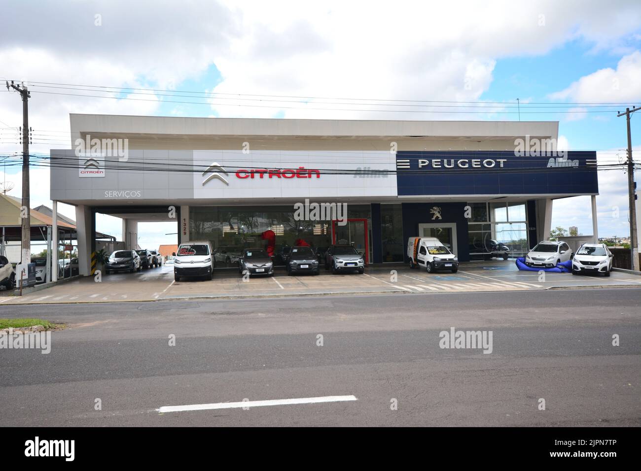 Facade of a Citroen and Peugeot car dealership or dealership, in a city in the interior of São Paulo, Brazil, panoramic photo Stock Photo