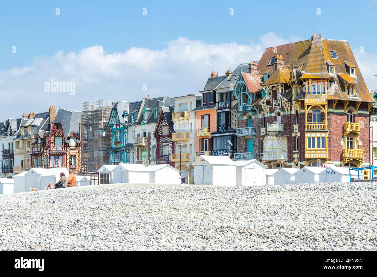 France, Somme, Picardie, Mers les Bains, pebbles beach with  beach cabins and Belle Epoque seaside villas of the 19th century // France, Somme (80), P Stock Photo