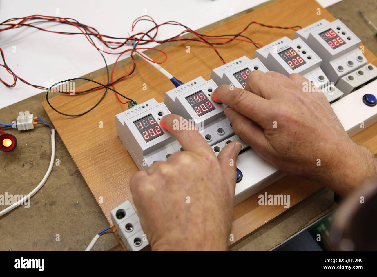 Service center for the repair of power voltage relays. Human checking