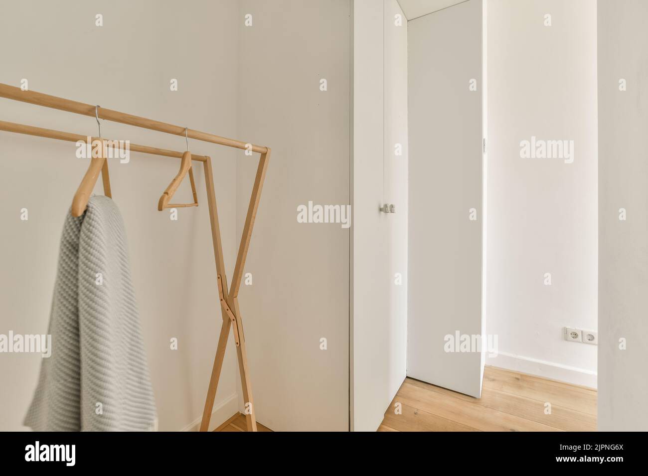 Interior of minimalist style narrow hallway with wardrobe and