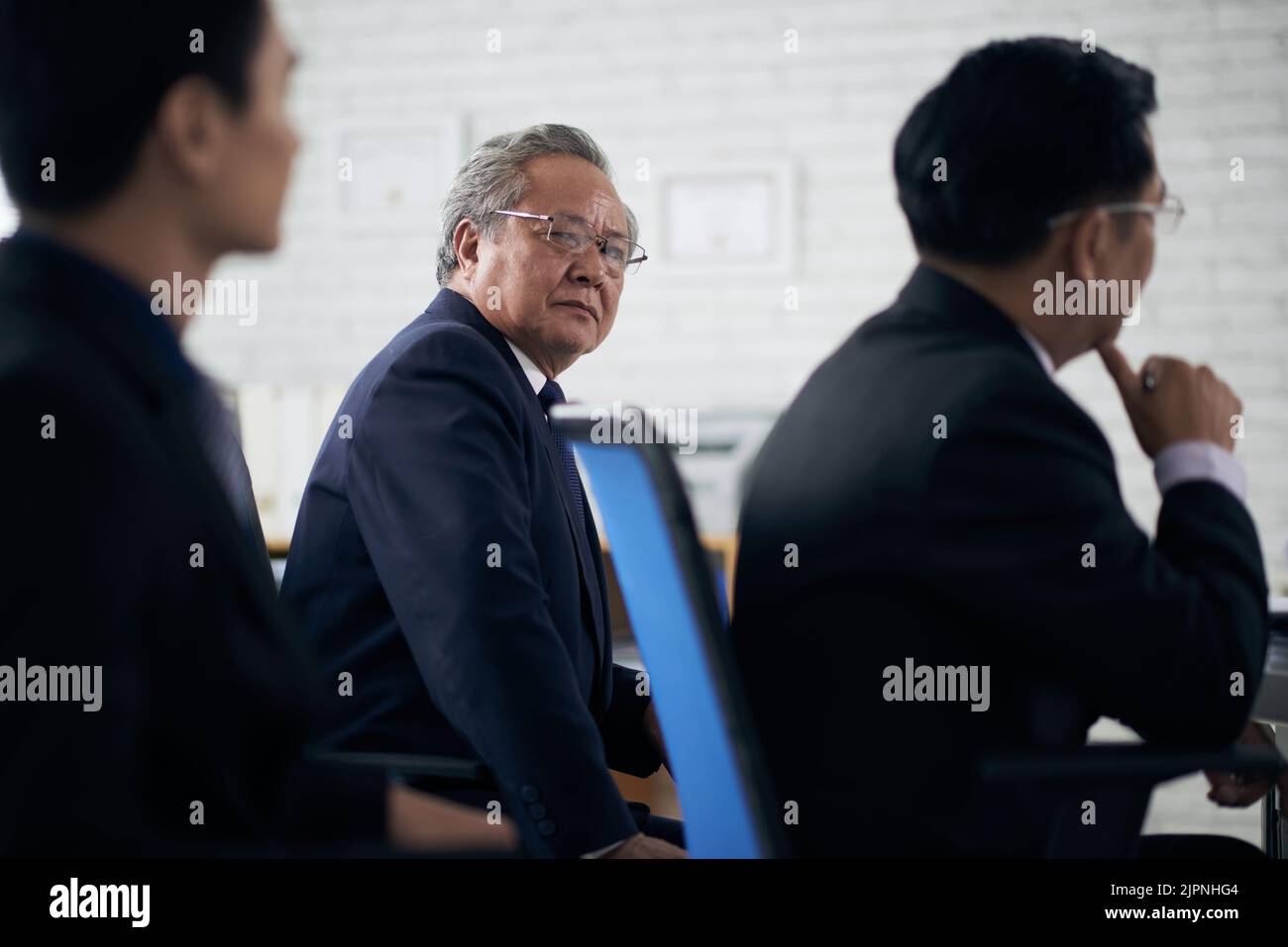 Senior Vietnamese attorney attending meeting Stock Photo Alamy