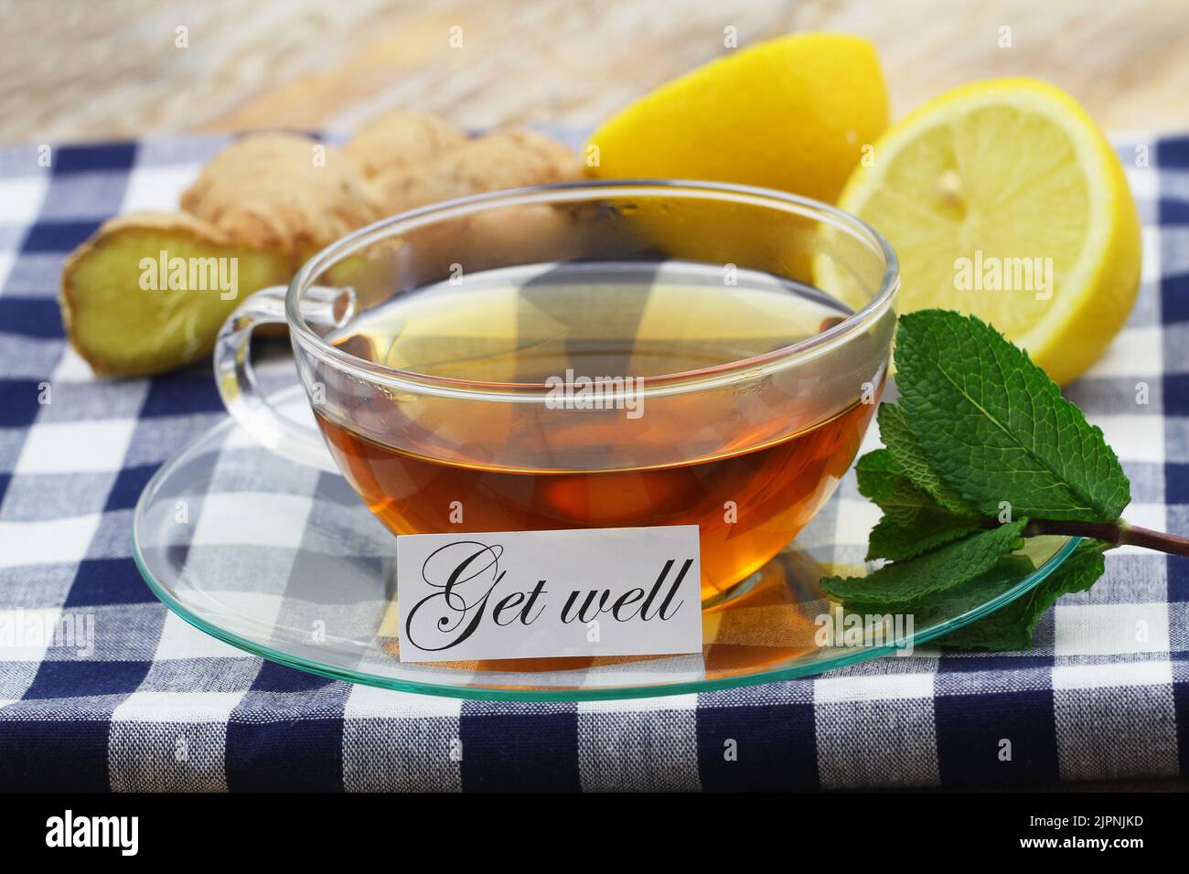 Get well card with cup of hot tea, lemon, mint and fresh ginger Stock Photo