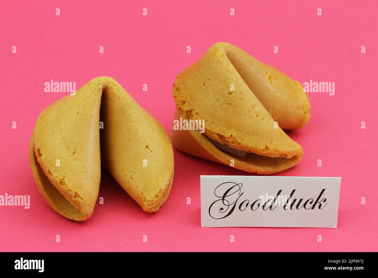 Good luck card with two Chinese fortune cookies on vivid pink background Stock Photo