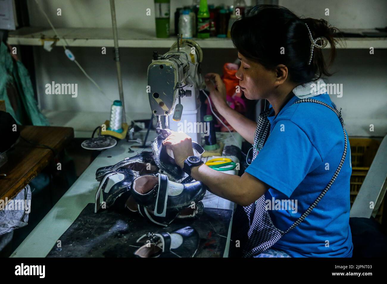 Marikina City, Philippines. 19th Aug, 2022. A worker makes leather