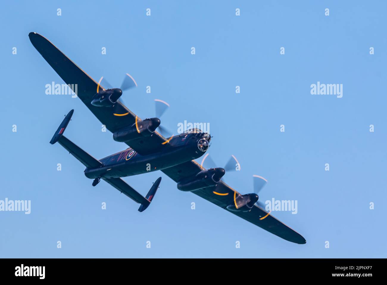 Eastbourne, Sussex, UK. 18th August 2022: The Battle of Britain display team in action over Eastbourne. With 2 spitfires and a Lancaster bomber. Stock Photo