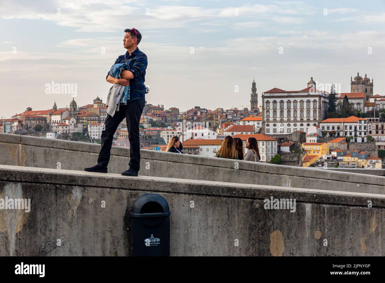 Tourists admiring the view of the historic city centre in Porto a major city in northern Portugal. Stock Photo