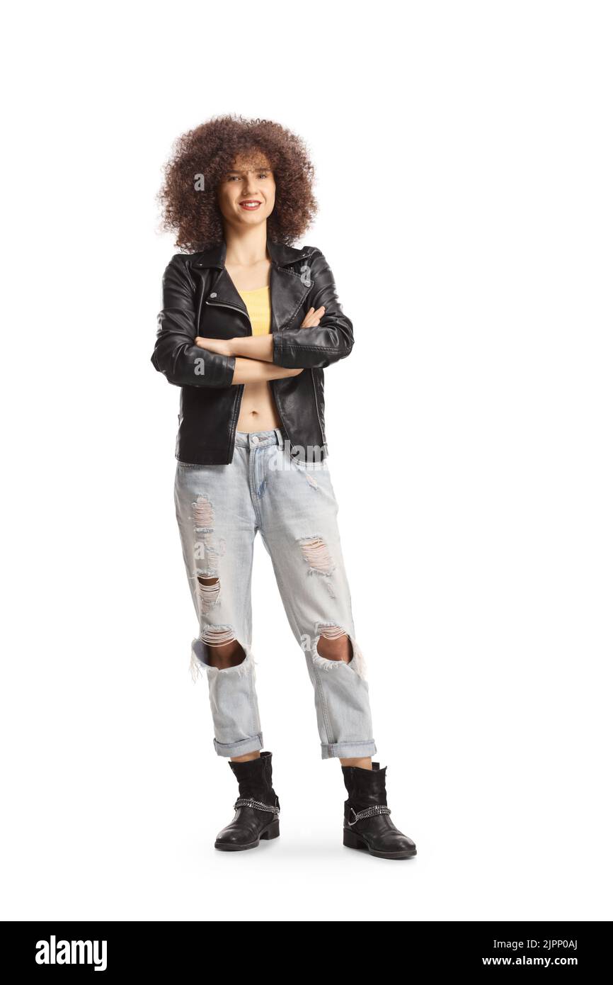 Full length portrait of a young Caucasian woman with afro hairstyle wearing a leather jacket and jeans isolated on white background Stock Photo