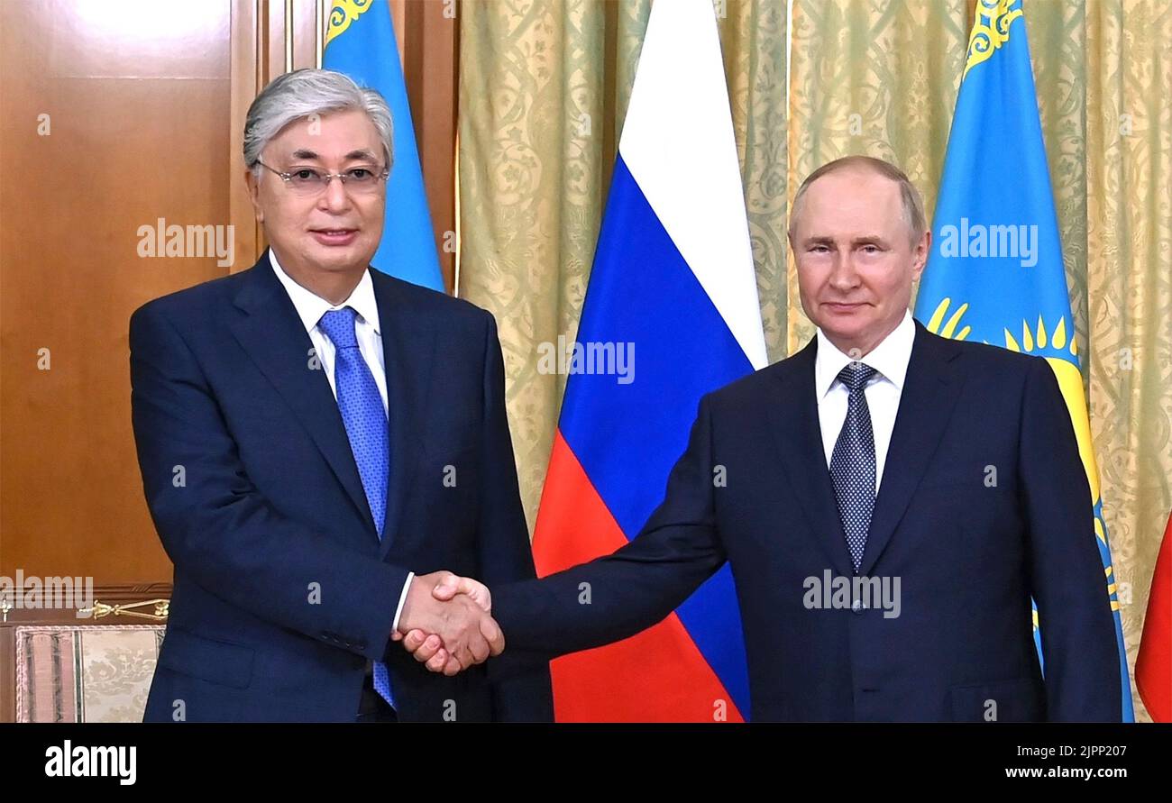 Sochi, Russia. 19th Aug, 2022. Russian President Vladimir Putin, right, shakes hands with Kazakhstan President Kassym-Jomart Tokayev at the start of a face-to-face bilateral meeting at his Black Sea vacation home at Cape Idokopas, August 19, 2022 in Sochi, Russia. Credit: Kremlin Pool/Russian Presidency/Alamy Live News Stock Photo
