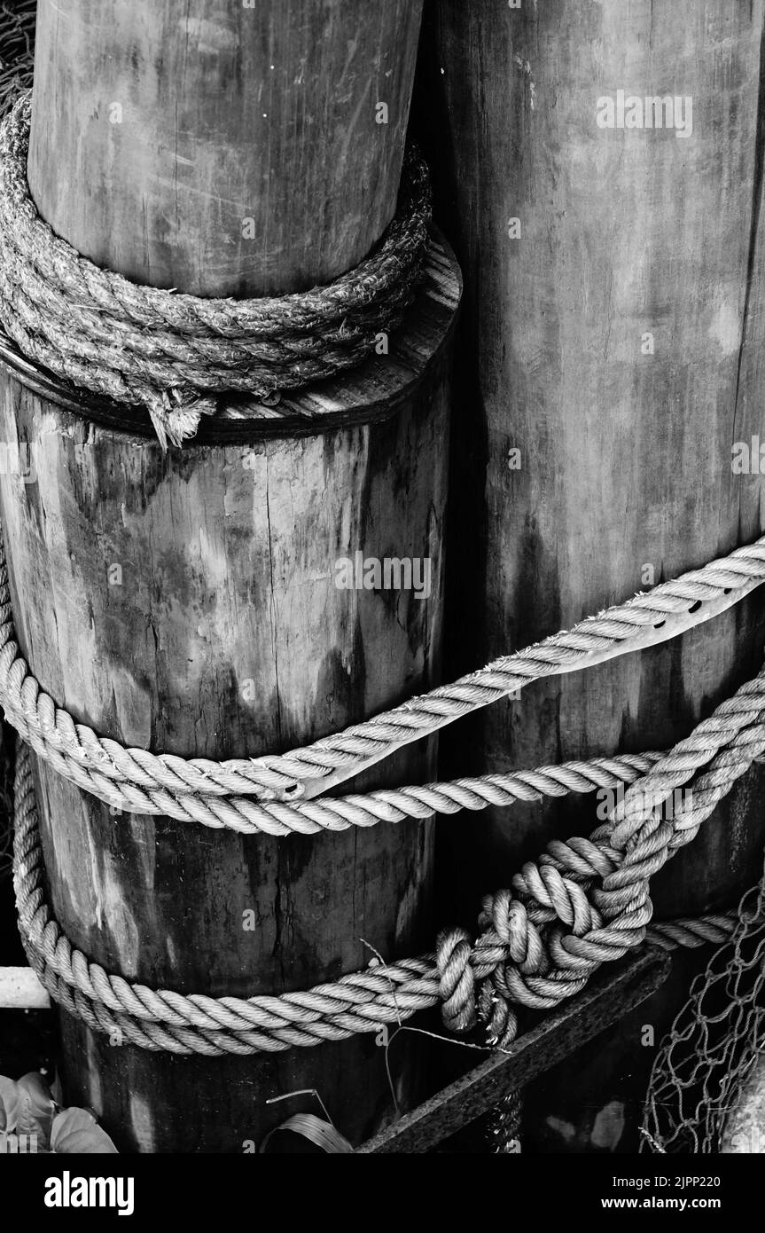 Wooden posts and rope Black and White Stock Photos & Images - Alamy