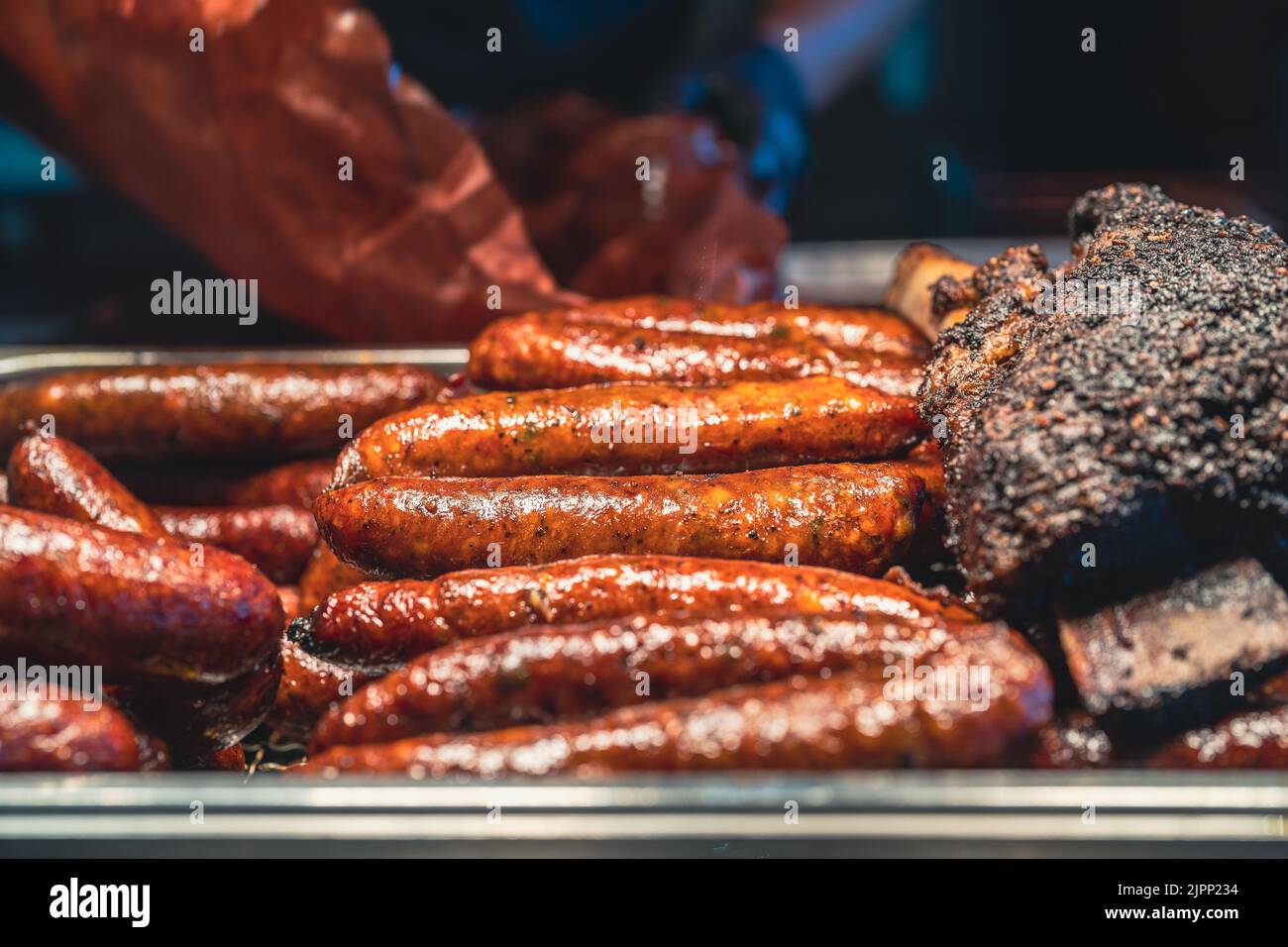 Delicious Texan Barbecue Spicy Sausages and Brisket. Stock Photo