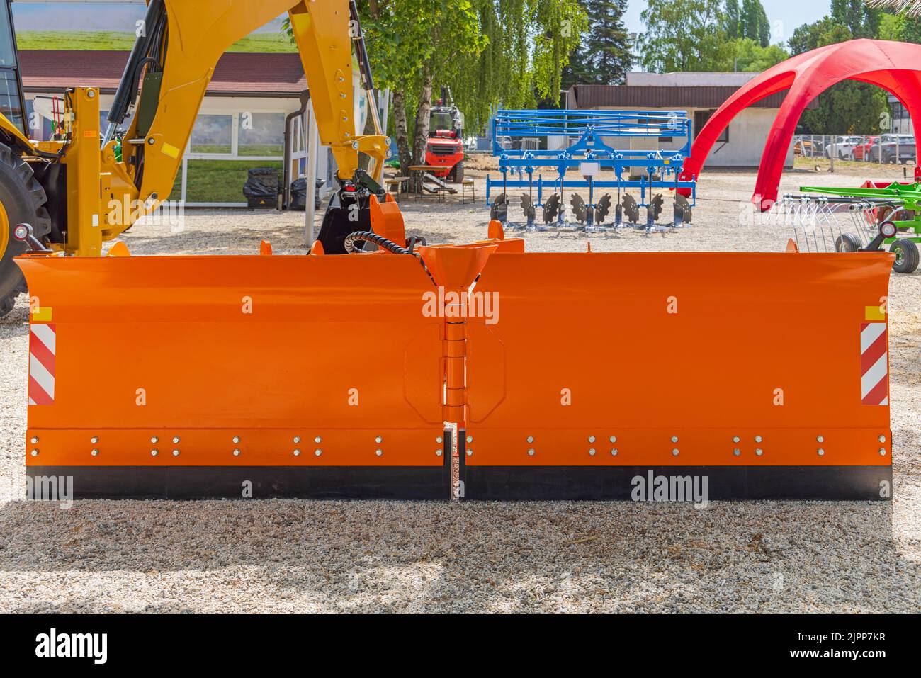 Long Orange Snow Plow Blade With Articulated Pivot Stock Photo - Alamy