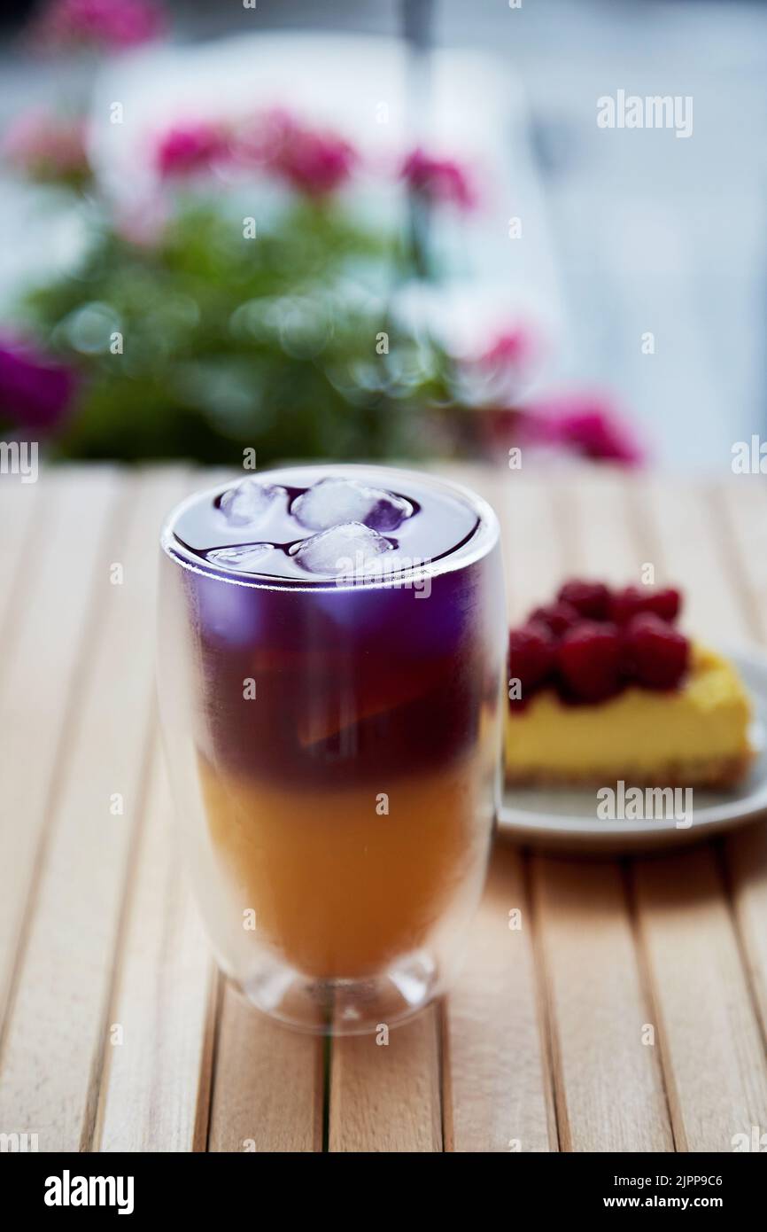 Natural summer cold refreshing purple and yellow cocktail. Anchan blue