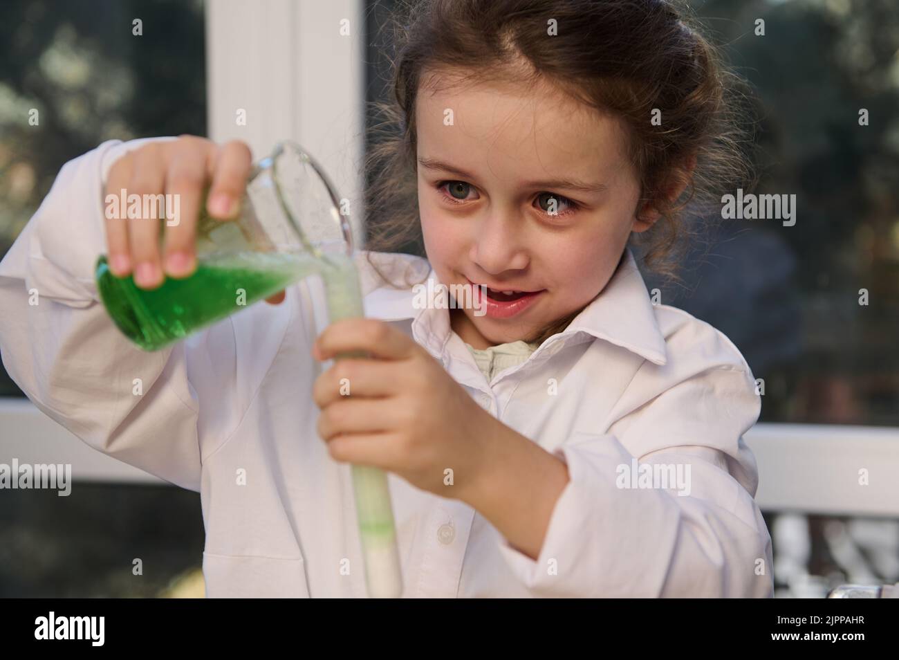 Scientist pouring liquid measuring beaker hires stock photography and images Alamy