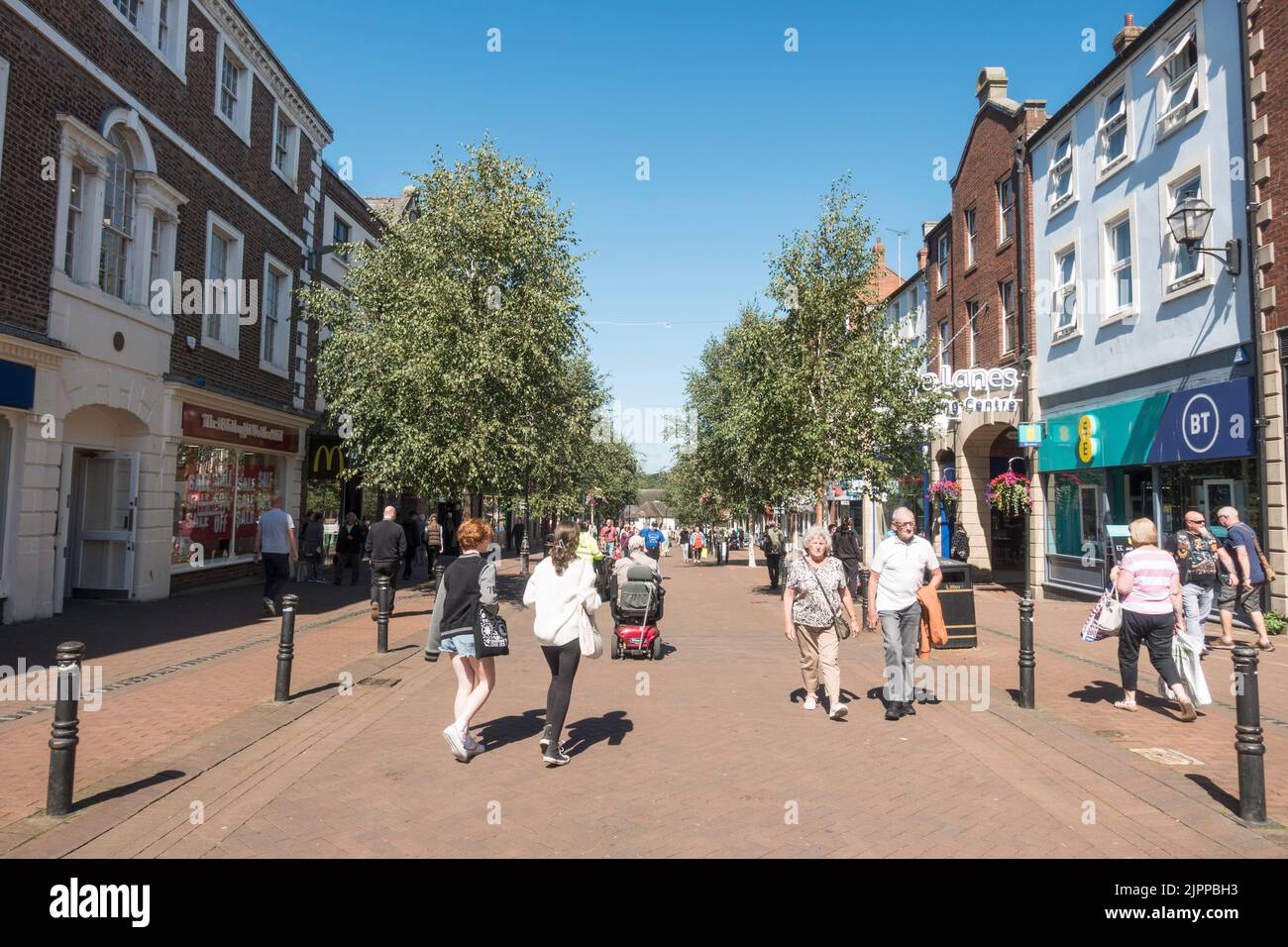 People walking along the pedestrianised Scotch Street in Carlisle city centre, Cumbria, England, UK Stock Photo