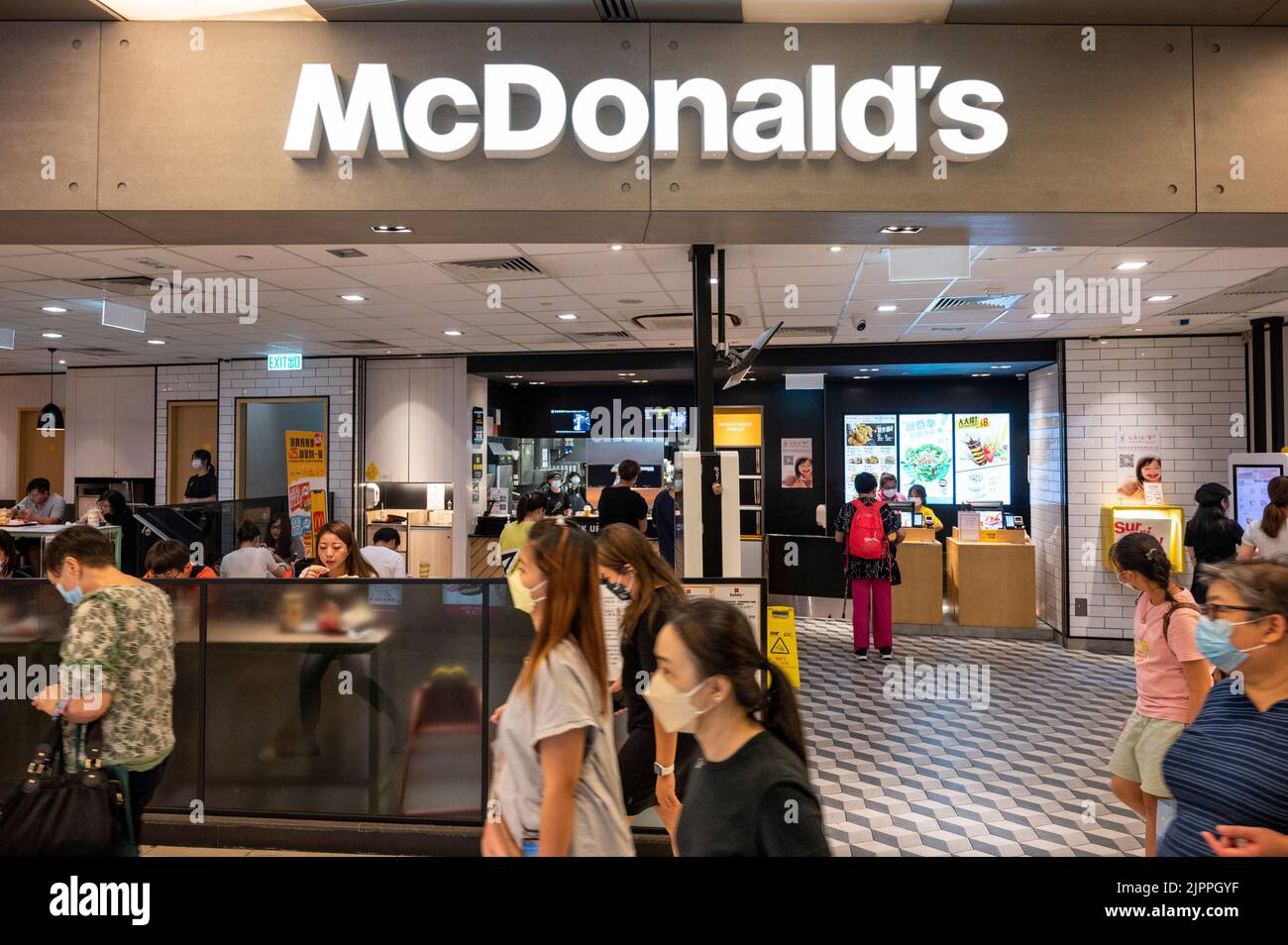 Shoppers walk past the American multinational fastfood hamburger