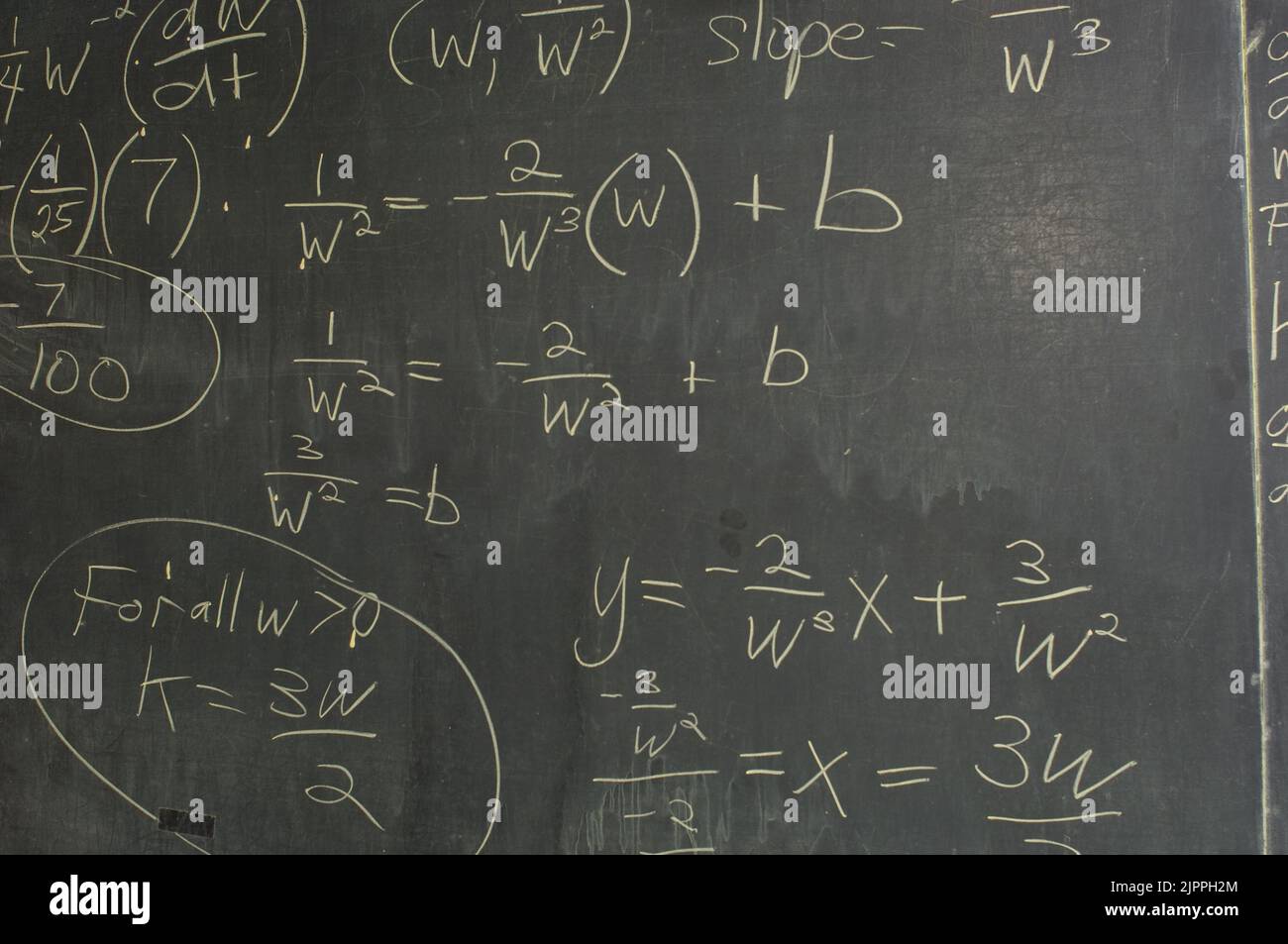 Education High School closeup of blackboard with algebra equations writton in chalk Stock Photo
