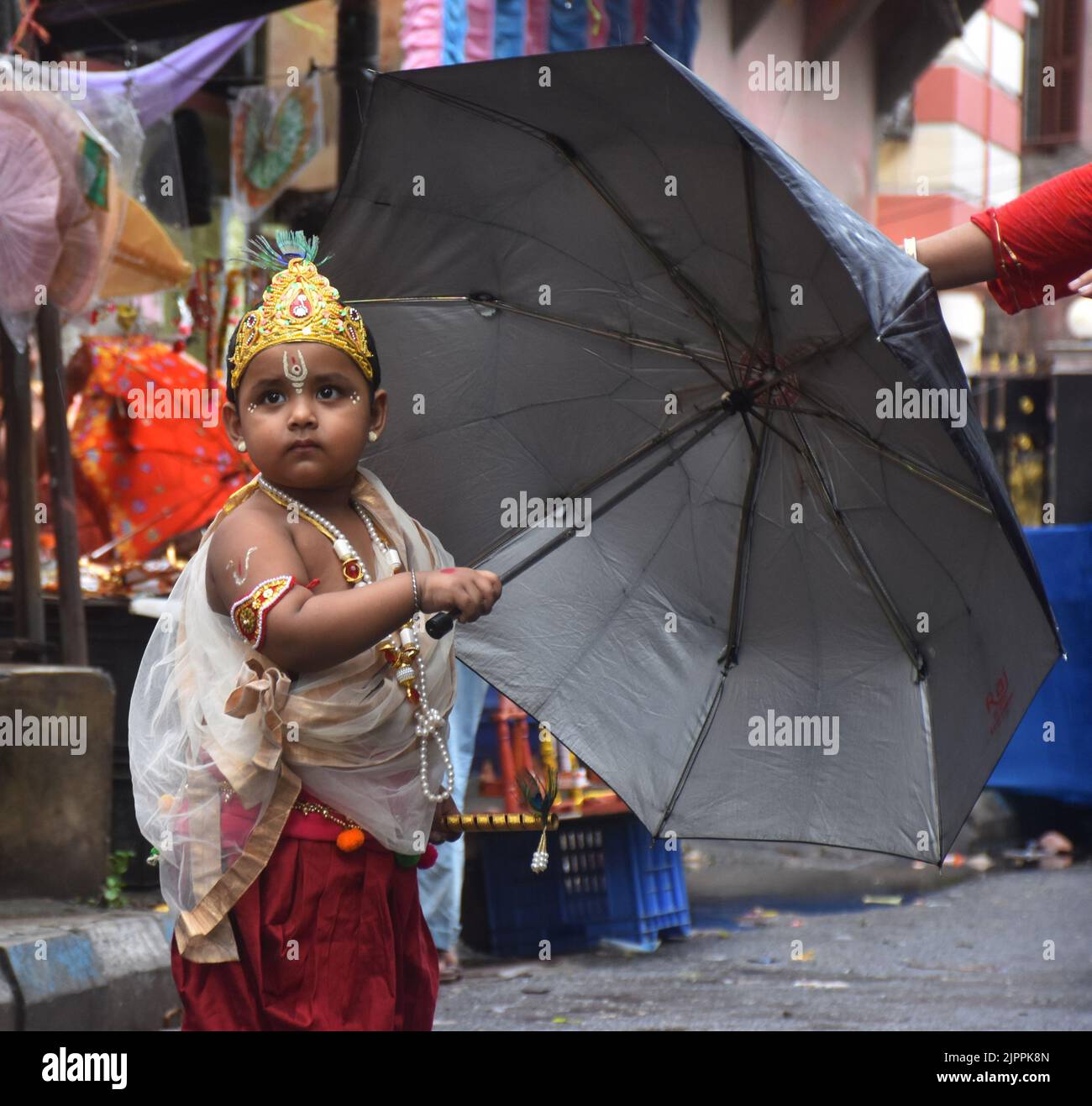 A little child in the guise of  Lord Sri Krishna Stock Photo