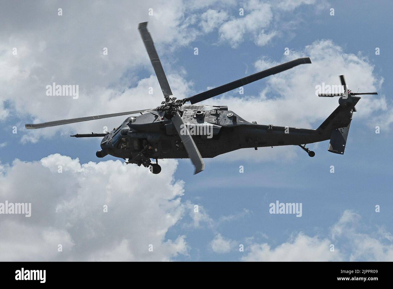 An HH-60G Pave Hawk assigned to the 55th Rescue Squadron, fly's over an ...