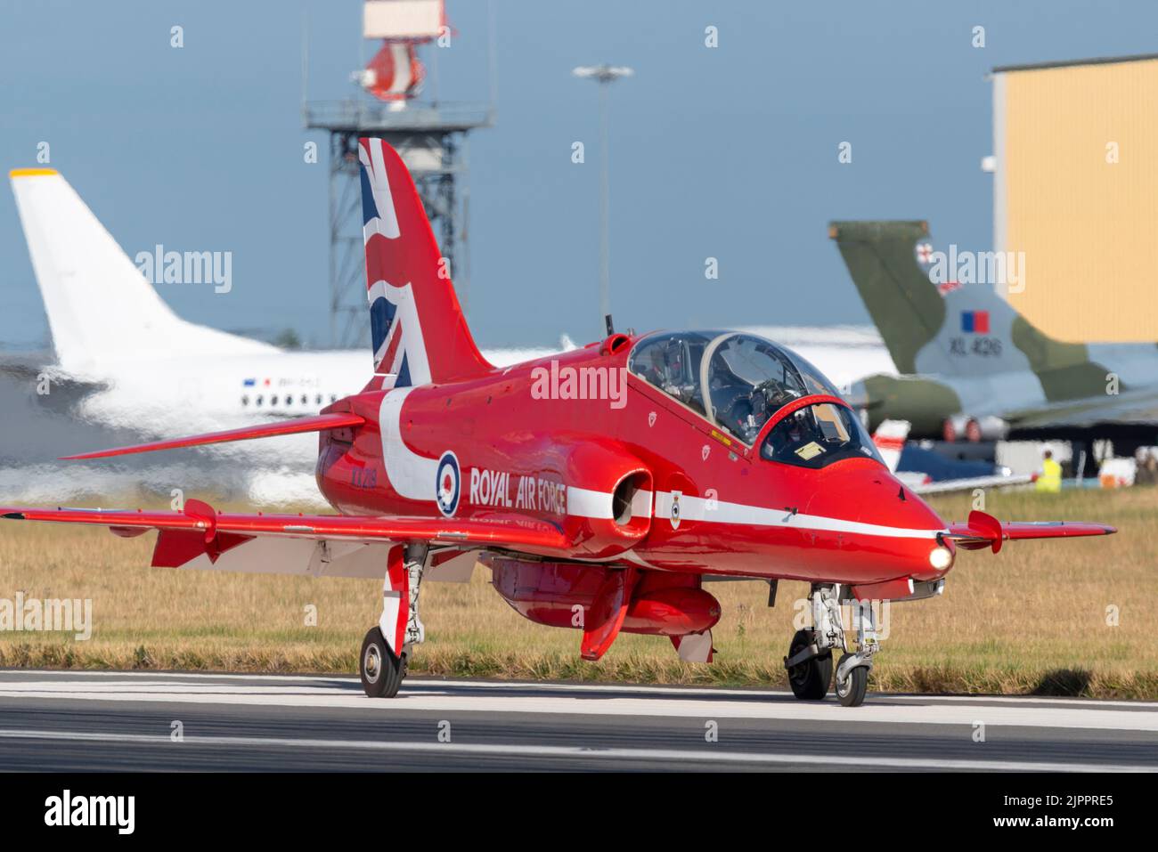 Royal Air Force Red Arrows display team BAe Hawk T.1 jet plane after landing at London Southend Airport for weekend of airshows. Taxiing on runway Stock Photo