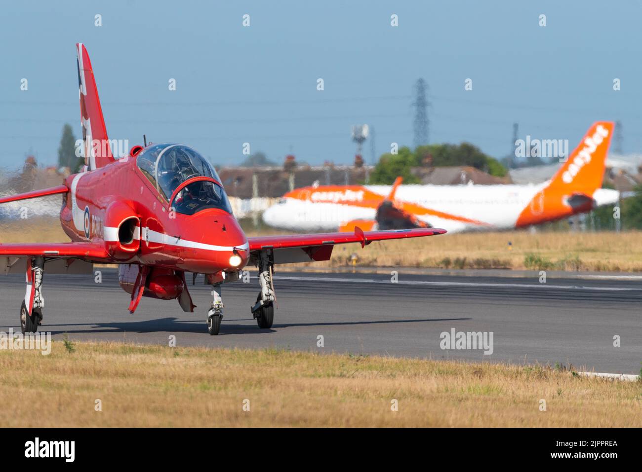 Royal Air Force Red Arrows display team BAe Hawk T.1 jet plane after landing at London Southend Airport for weekend of airshows. easyJet holding Stock Photo