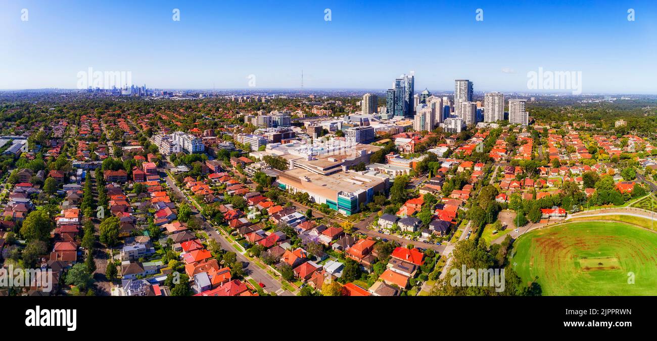 Aerial ciytscape panorama from Chatswood high-rise towers to distant Sydney city CBD skyline. Stock Photo