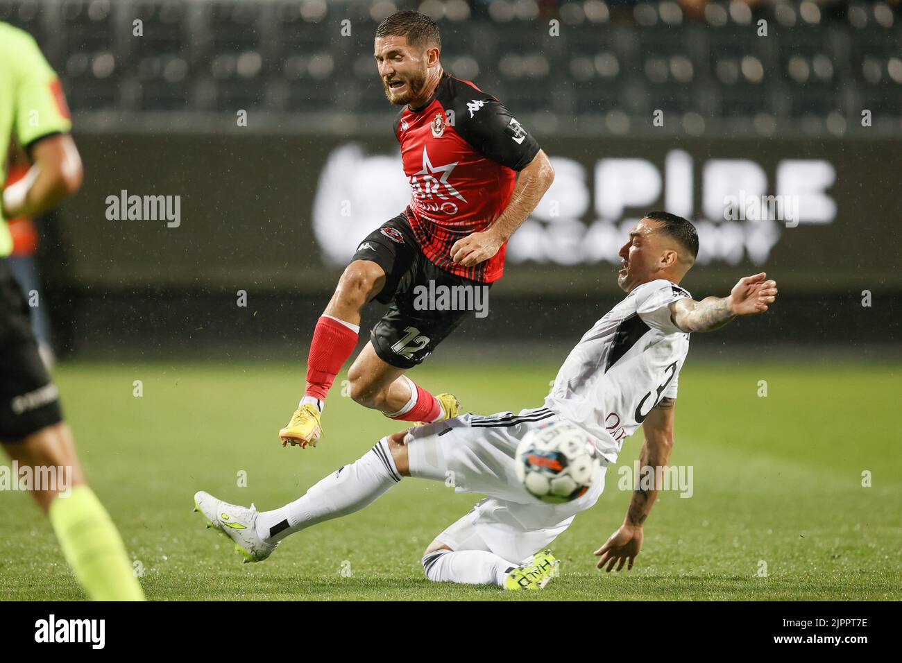 Seraing's Antoine Bernier and Eupen's Jason Davidson fight for the ball during a soccer match between KAS Eupen and RFC Seraing, Friday 19 August 2022 in Eupen, on day 5 of the 2022-2023 'Jupiler Pro League' first division of the Belgian championship. BELGA PHOTO BRUNO FAHY Stock Photo
