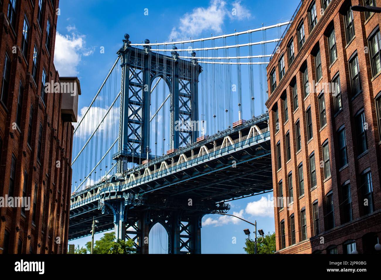 A beautiful low angle shot of the Manhattan Bridge in New York City ...