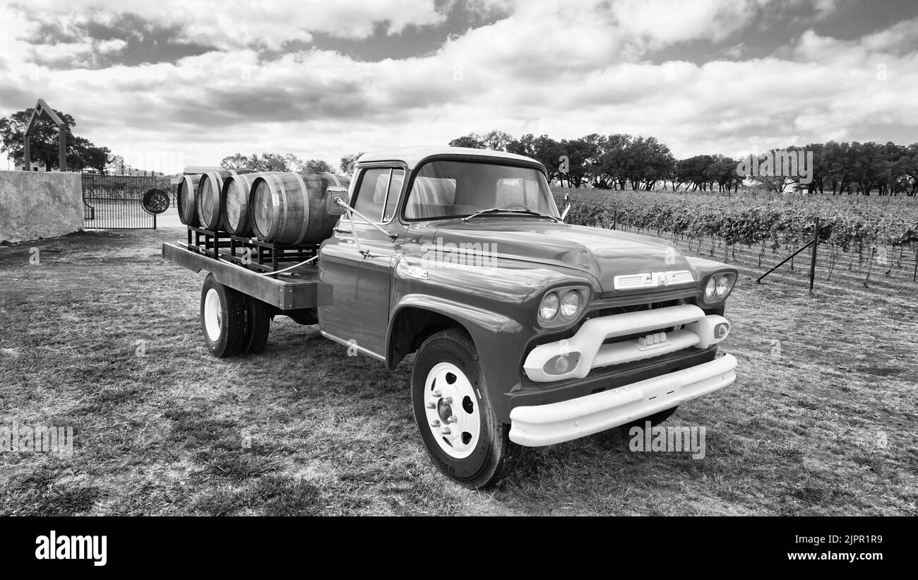 Fredericksburg,Texas- Nov.12-2020  Slate Mill Wine Collective Winery in Texas Hill Country with 1950 GMC wine truck and vineyards in the background. Stock Photo