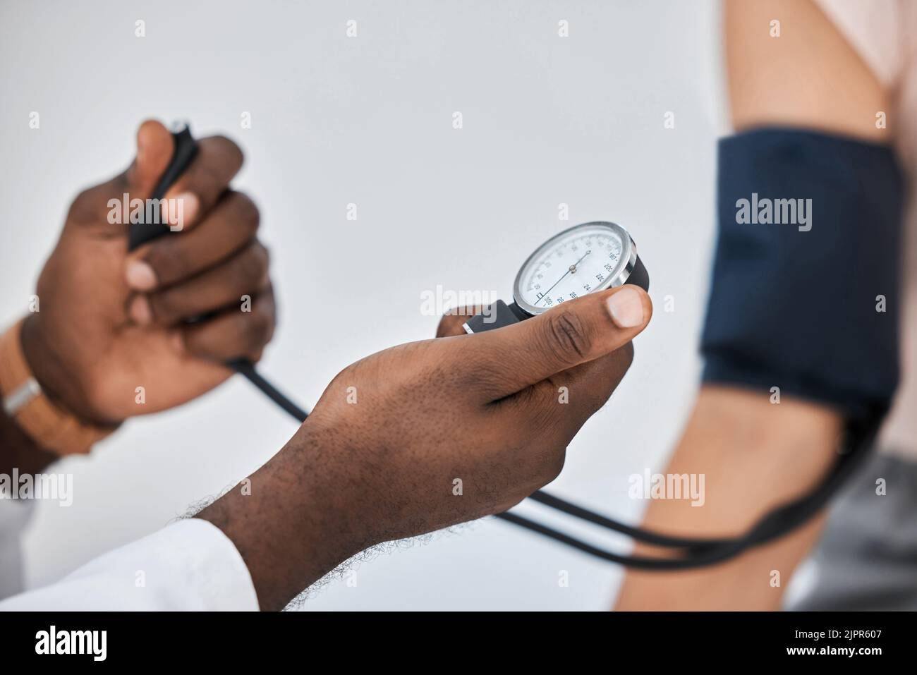 Blood pressure or hypertension test by a healthcare professional on a female at the clinic or