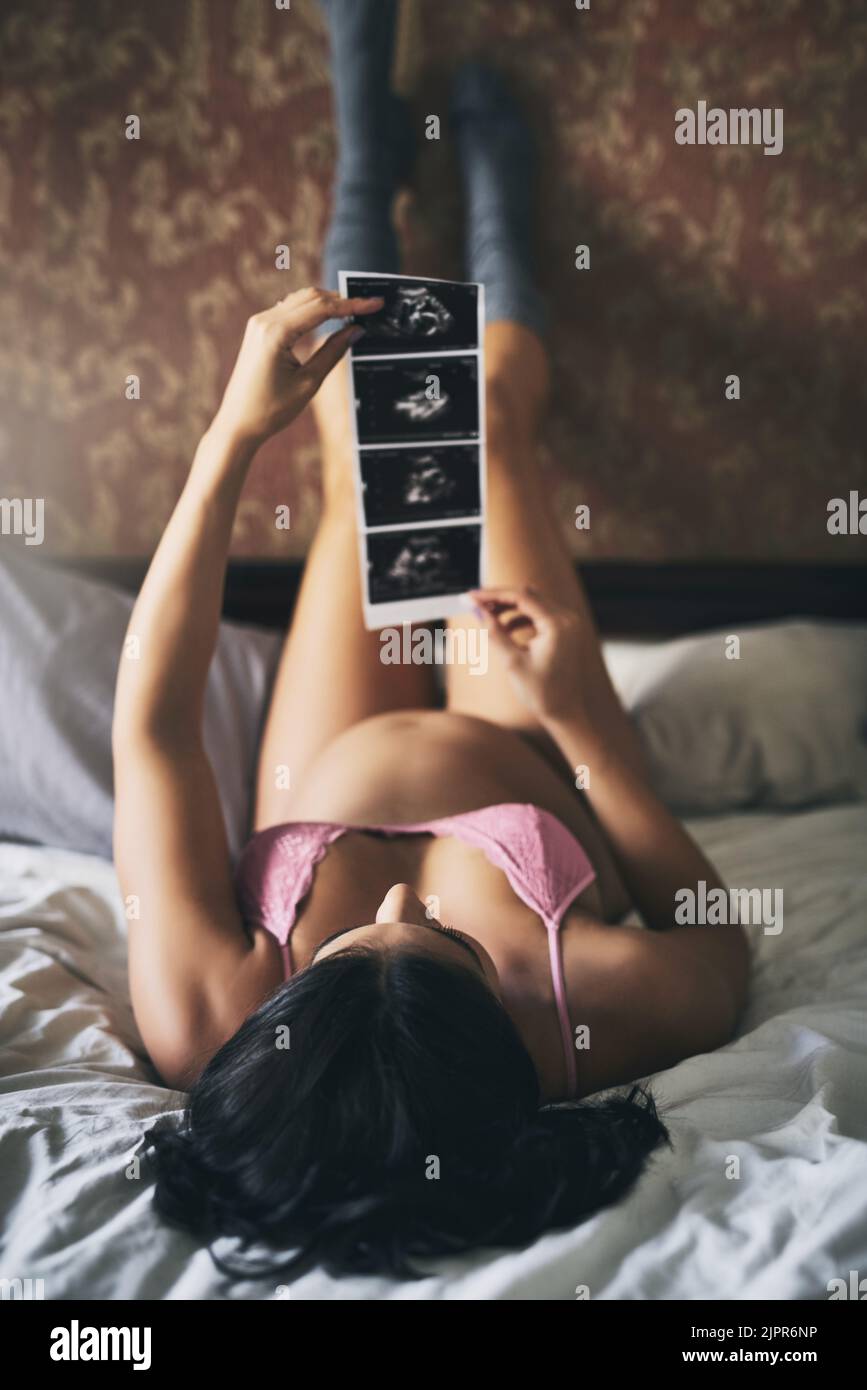 Woman lying bed full body hi-res stock photography and images